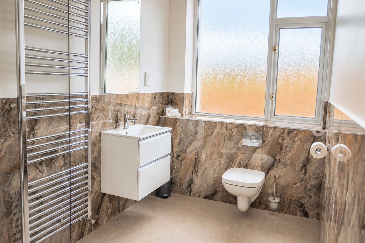 New en-suite bathroom with walk-in shower and heated towel rail
