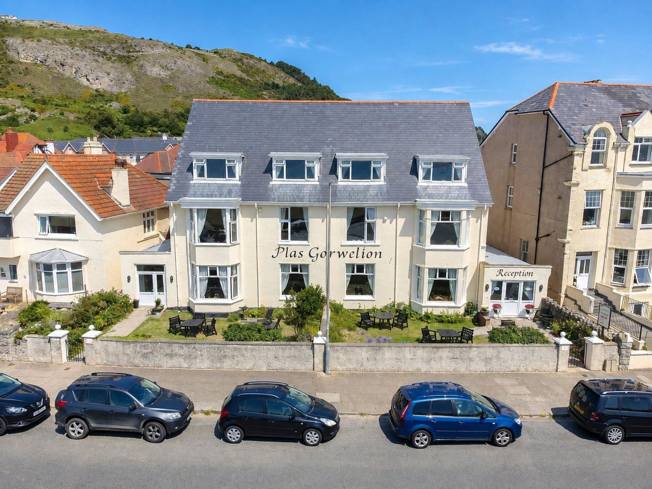 Plas Gorwelion — white Victorian house on West Parade with the Great Orme behind