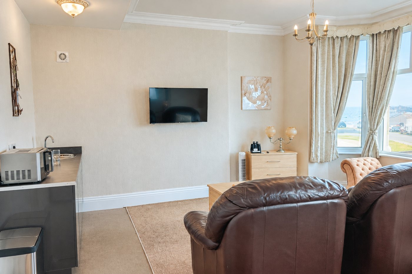 Inside a king suite — seating area and snack kitchenette